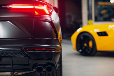 View of yellow car on city street