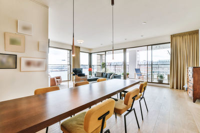 Empty chairs and tables in room