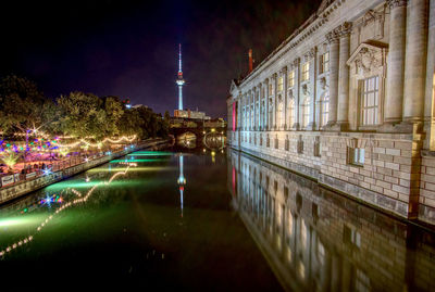 Illuminated buildings in city at night