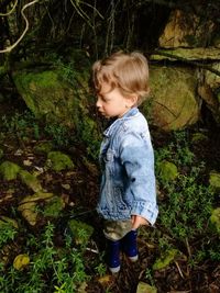 Boy standing on field at park