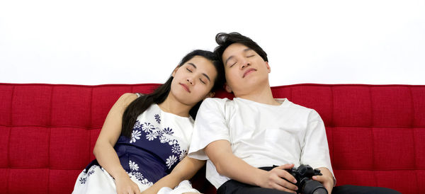 Young couple sitting on sofa