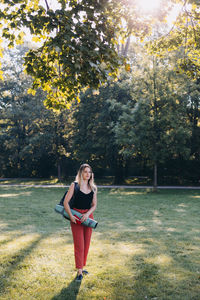 Full length of woman standing on field