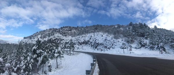 Panoramic view of snowcapped mountain against sky