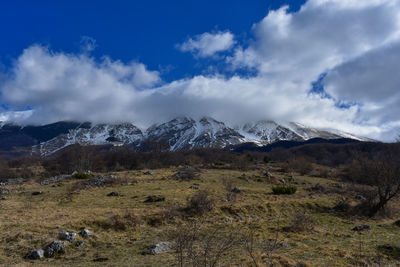 Scenic view of snowcapped mountains against sky