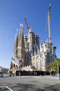 Low angle view of buildings against blue sky