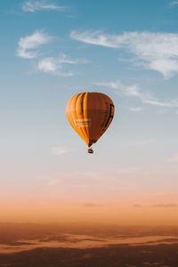 Low angle view of hot air balloon against sky during sunset