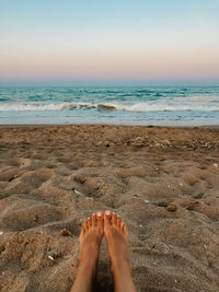 Low section of person on beach