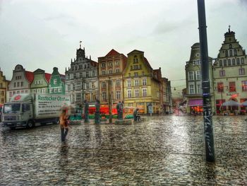 Buildings in city against sky