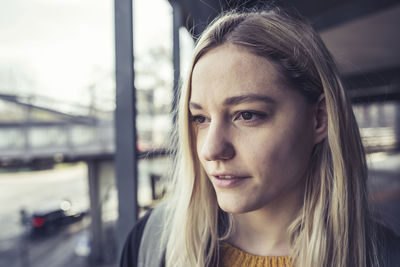 Close-up of young woman looking away