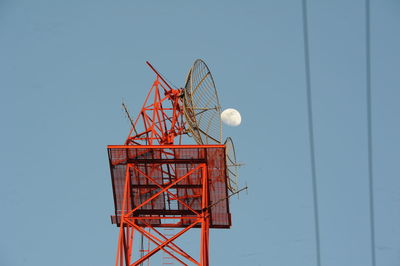 Low angle view of communications tower against clear sky