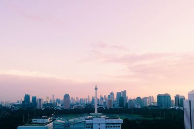 Cityscape against sky during sunset