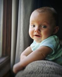 Portrait of cute baby girl at home