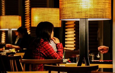 Woman sitting at restaurant