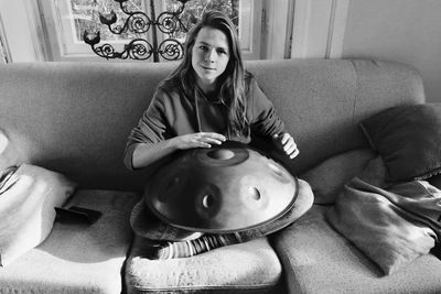 Woman sitting on sofa