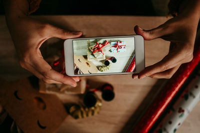 High angle view of woman using mobile phone