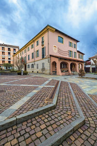 View of old building against cloudy sky