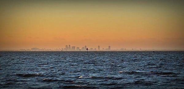 Scenic view of sea against sky during sunset