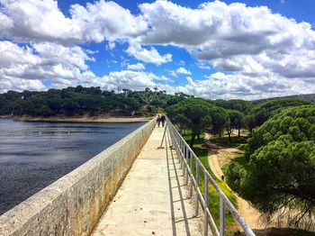 Bridge over river against sky