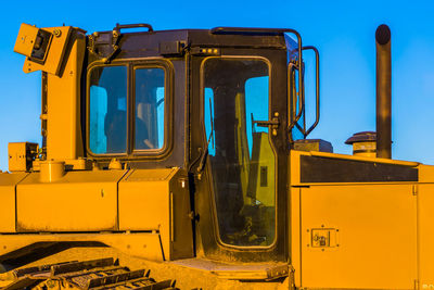 Abandoned train against blue sky