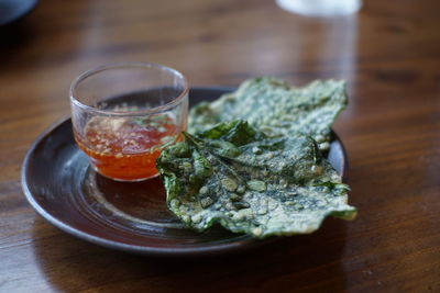 Close-up of drink served on table