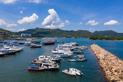 Sailboats moored in bay