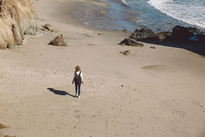 High angle view of man standing on beach