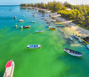 High angle view of sailboats moored on sea