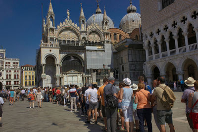 Venice, italy long queue of tourists for getting entry at famous main attraction st mark s basilica