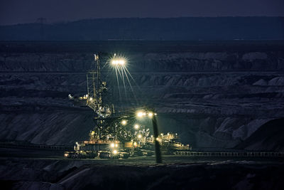 High angle view of illuminated lights at night