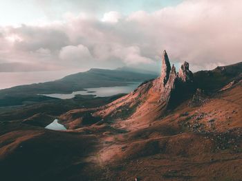 Panoramic view of land and mountains against sky