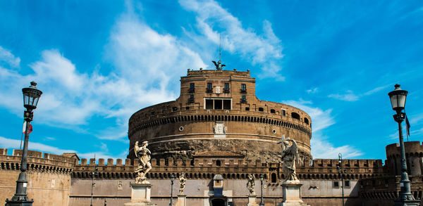 Low angle view of historical building against blue sky