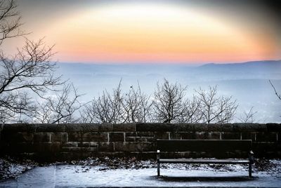 Scenic view of landscape against sky at sunset