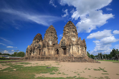 Low angle view of temple against cloudy sky