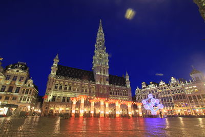 Illuminated buildings in city at night