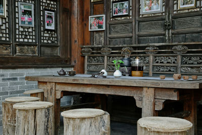 Empty chairs and table in old building