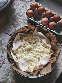 Preparing pie and eggs on table