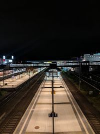 High angle view of railroad station platform at night