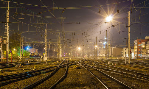 View of illuminated railroad tracks at night