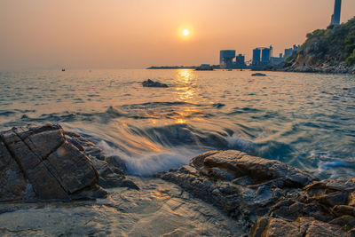 Scenic view of sea at sunset