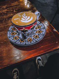 High angle view of coffee cup on table