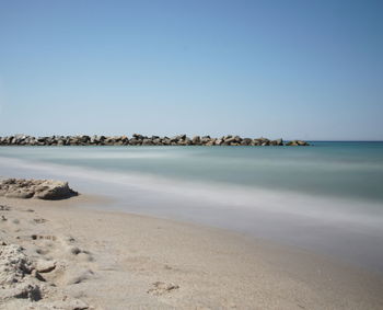 Scenic view of sea against clear sky