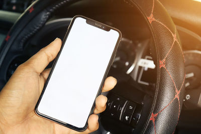 Close-up of hand using mobile phone