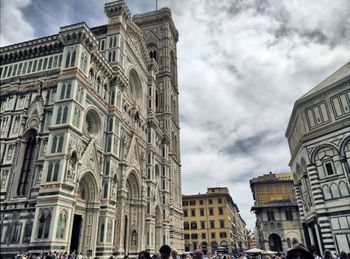 Low angle view of buildings against sky in city