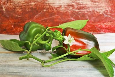 Close-up of green peppers on table