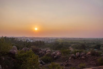 Scenic view of landscape against sky during sunset