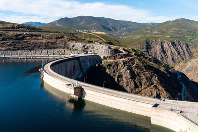 The atazar reservoir and dam in the mountain range of madrid.