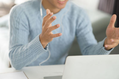 Midsection of woman using mobile phone