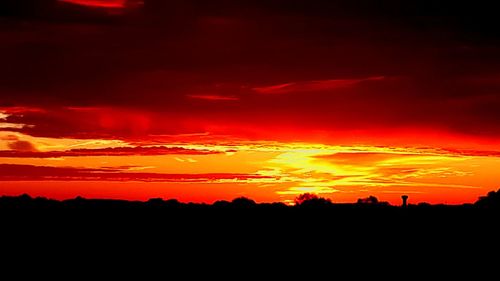 Scenic view of dramatic sky during sunset