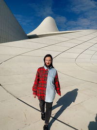 Portrait of woman standing on snow