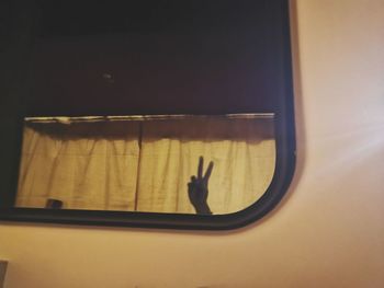 Shadow of person on window